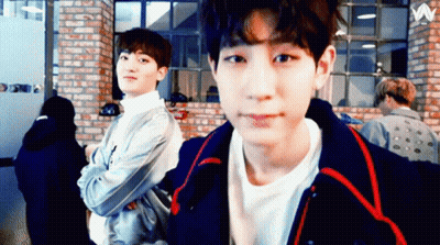 Two Young Men By Brick Wall With Letter W GIF