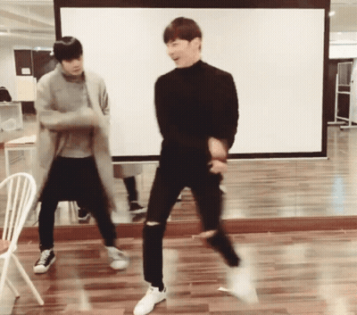Two Young Men Dancing In Front Of Mirror GIF