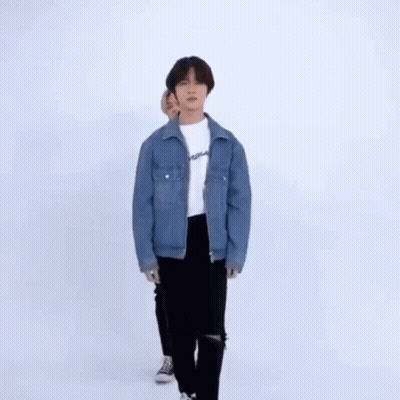Two Young Men Dancing In Front Of White Wall GIF