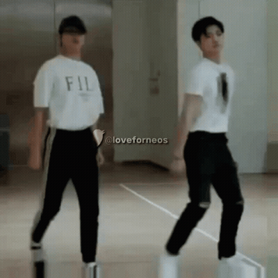 Two Young Men Dancing, One In FIL Shirt GIF