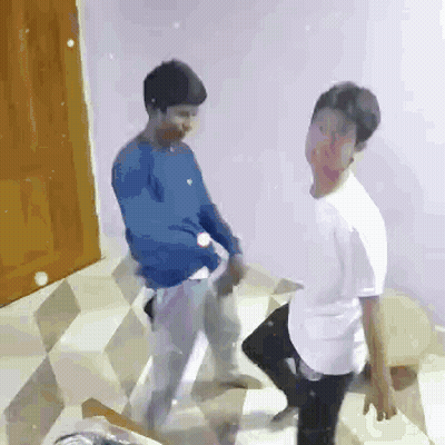 Two Young Men Dancing Together GIF