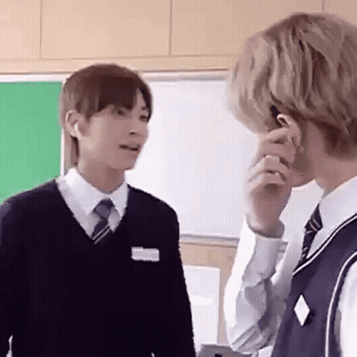 Two Young Men In School Uniforms Talking GIF