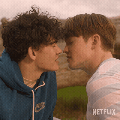 Two Young Men Kissing With A Netflix Logo In The Corner GIF