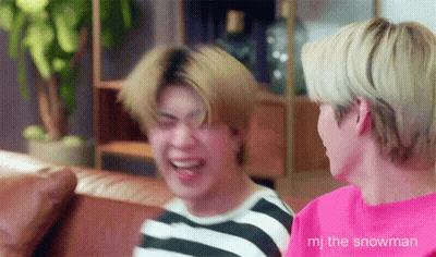 Two Young Men Laughing On Couch GIF
