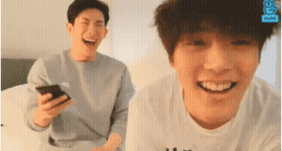Two Young Men Laughing One Holding Phone GIF