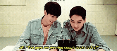 Two Young Men Looking At Cell Phone Saying You Guys Are Wearing Couple Looks Today GIF