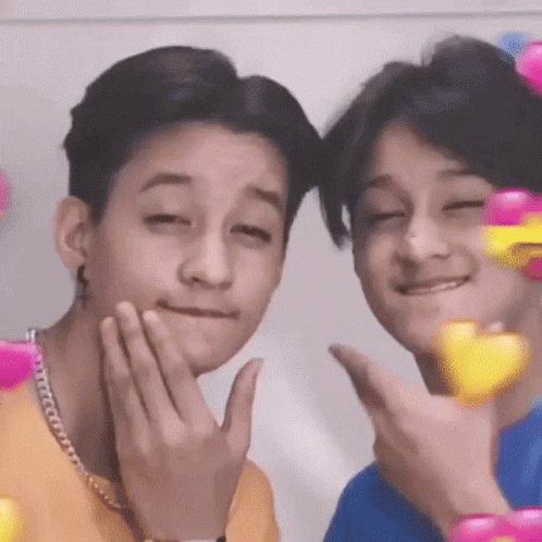 Two Young Men Making Faces GIF