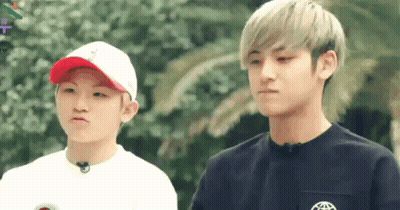 Two Young Men Making Funny Faces One With Hat GIF