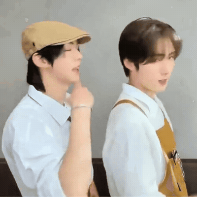 Two Young Men, One In Hat, One In Apron GIF