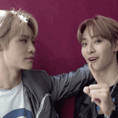 Two Young Men One Pointing At The Other GIF