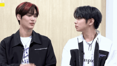 Two Young Men One Wearing Aspic Shirt GIF
