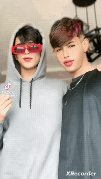Two Young Men Posing For Picture GIF