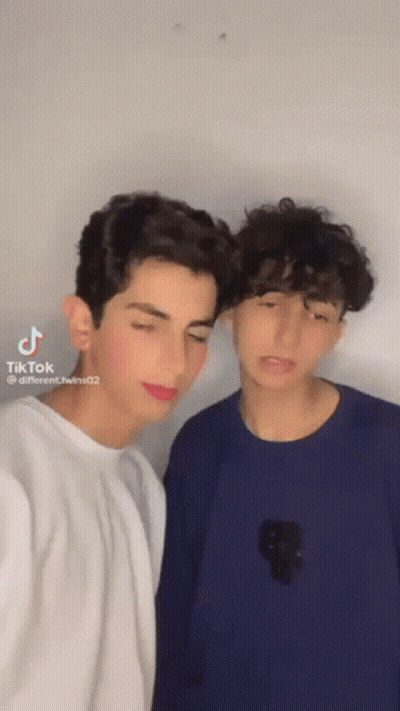 Two Young Men Posing For Picture With TikTok Watermark GIF