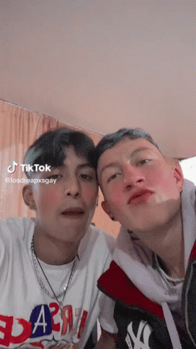 Two Young Men Posing One in Yankees Jacket