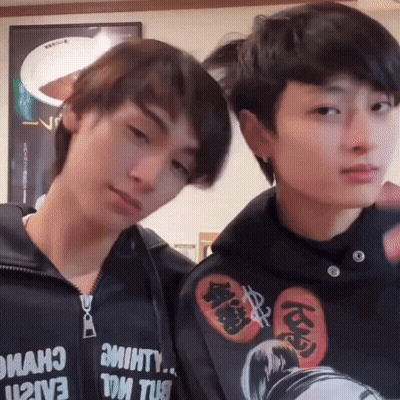 Two Young Men Posing One Wearing Hoodie Saying Almost GIF