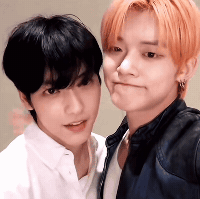 Two Young Men Posing One With Red Hair GIF