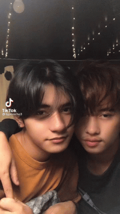 Two Young Men Posing With TikTok Text GIF