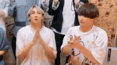 Two Young Men Sitting And Clapping GIF