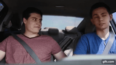 Two Young Men Sitting In Car With Seat Belts GIF