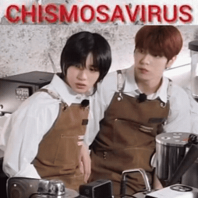 Two Young Men Sitting In Kitchen GIF