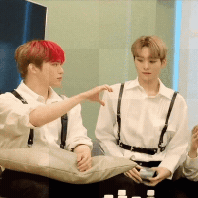 Two Young Men Sitting On Couch One With Red Hair GIF