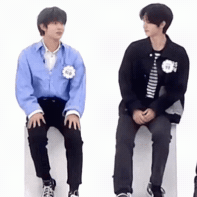 Two Young Men Sitting On White Box GIF