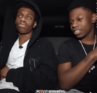 Two Young Men Sitting One Wearing Black Hoodie GIF