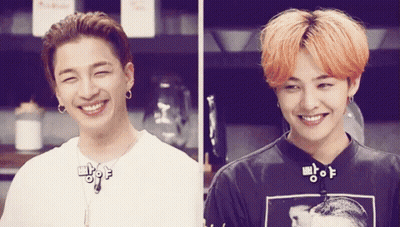 Two Young Men Smiling In Kitchen GIF