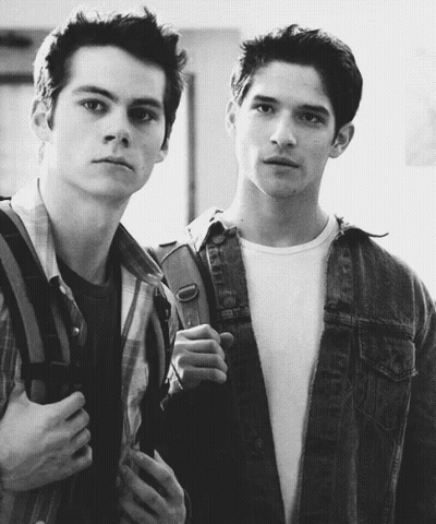 Two Young Men Standing Next To Each Other One With Backpack GIF