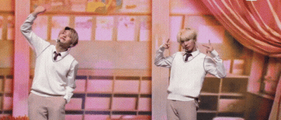 Two Young Men Standing On Stage GIF