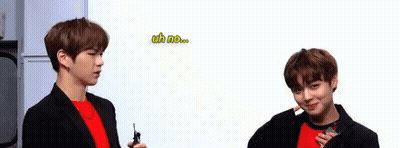 Two Young Men Standing Together GIF
