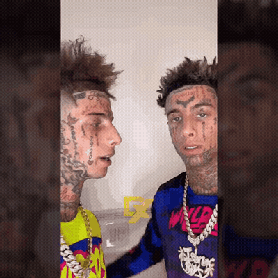 Two Young Men With Face Tattoos Standing Together GIF