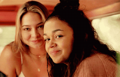 Two Young Women Are Posing For A Picture Together And Smiling GIF