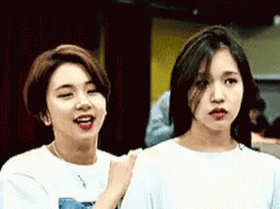 Two Young Women Looking At Each Other GIF
