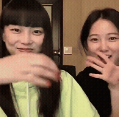 Two Young Women Making Funny Faces GIF