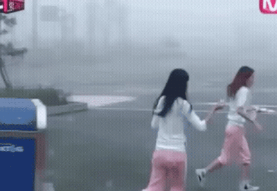 Two Young Women Walking In Fog GIF