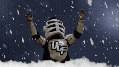 UCF Mascot Standing In Snow With Arms In Air GIF