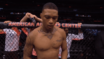 UFC Fighter Holding Flag In Ring GIF