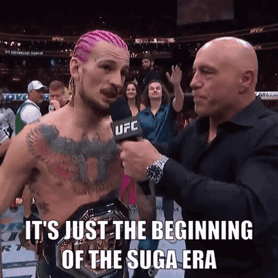 UFC Reporter Interviewing Man With Pink Hair GIF
