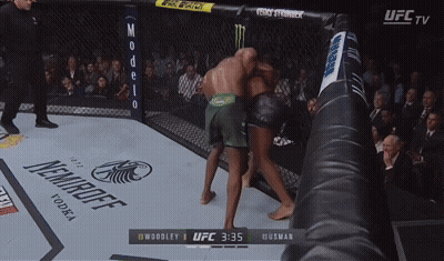 Ufc Tv Shows A Boxing Match Between Woodley And Husman At 3:35 GIF