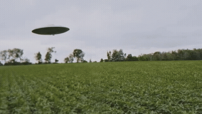 UFO Flying Over Grassy Field