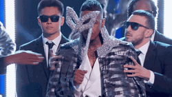 Unmasking Host Nick Cannon GIF