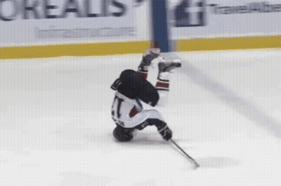 Upside Down Hockey Player On Ice GIF