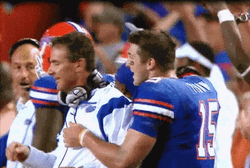 Urban Meyer Smiling While Hugging GIF