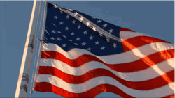 Usa Flag Waving Against Blue Sky GIF