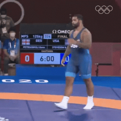USA Wrestler Standing On Mat In Front Of Scoreboard GIF