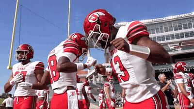 Utah Football Players Huddled On Field GIF