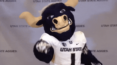 Utah State Aggies Mascot In Front Of Wall GIF
