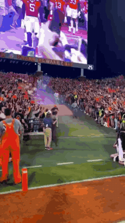Utah State Aggies Mascot Standing In Front Of Wall GIF