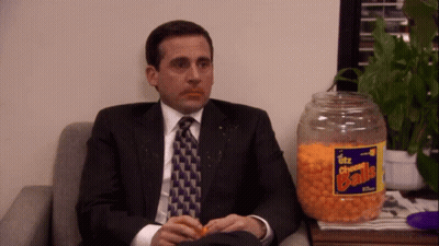 Utz Cheese Balls Jar Next To Man In Suit GIF